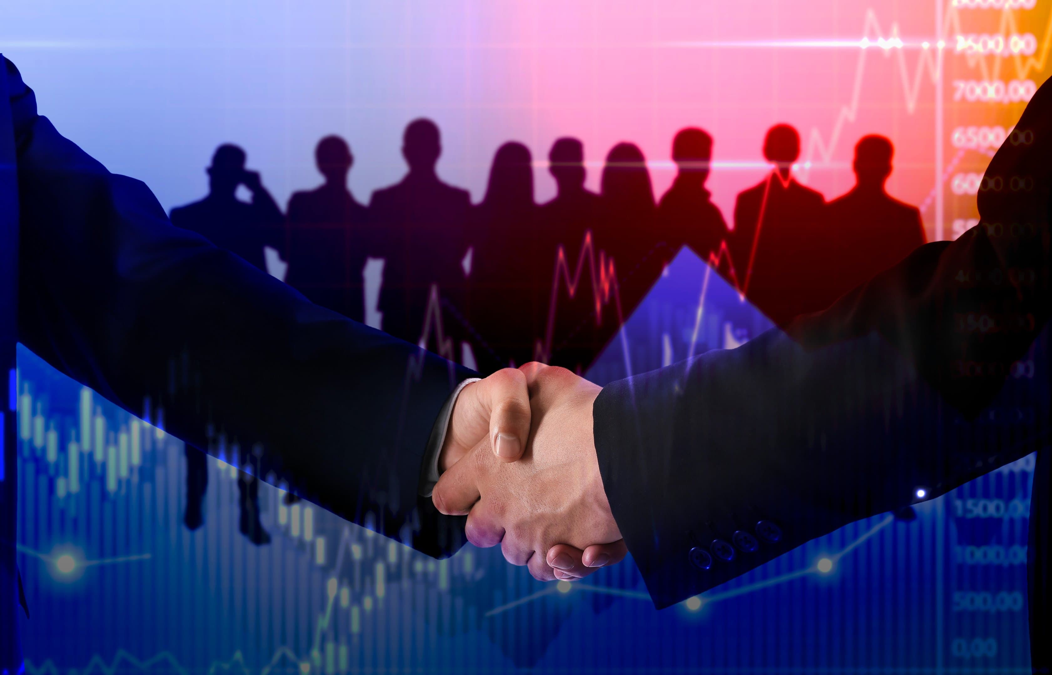 Business handshake over financial data